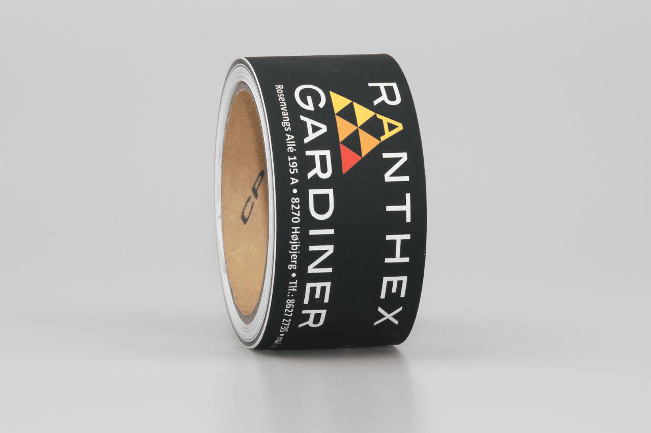 Papirbånd Neg. med eget logo 50mm x 50mtr