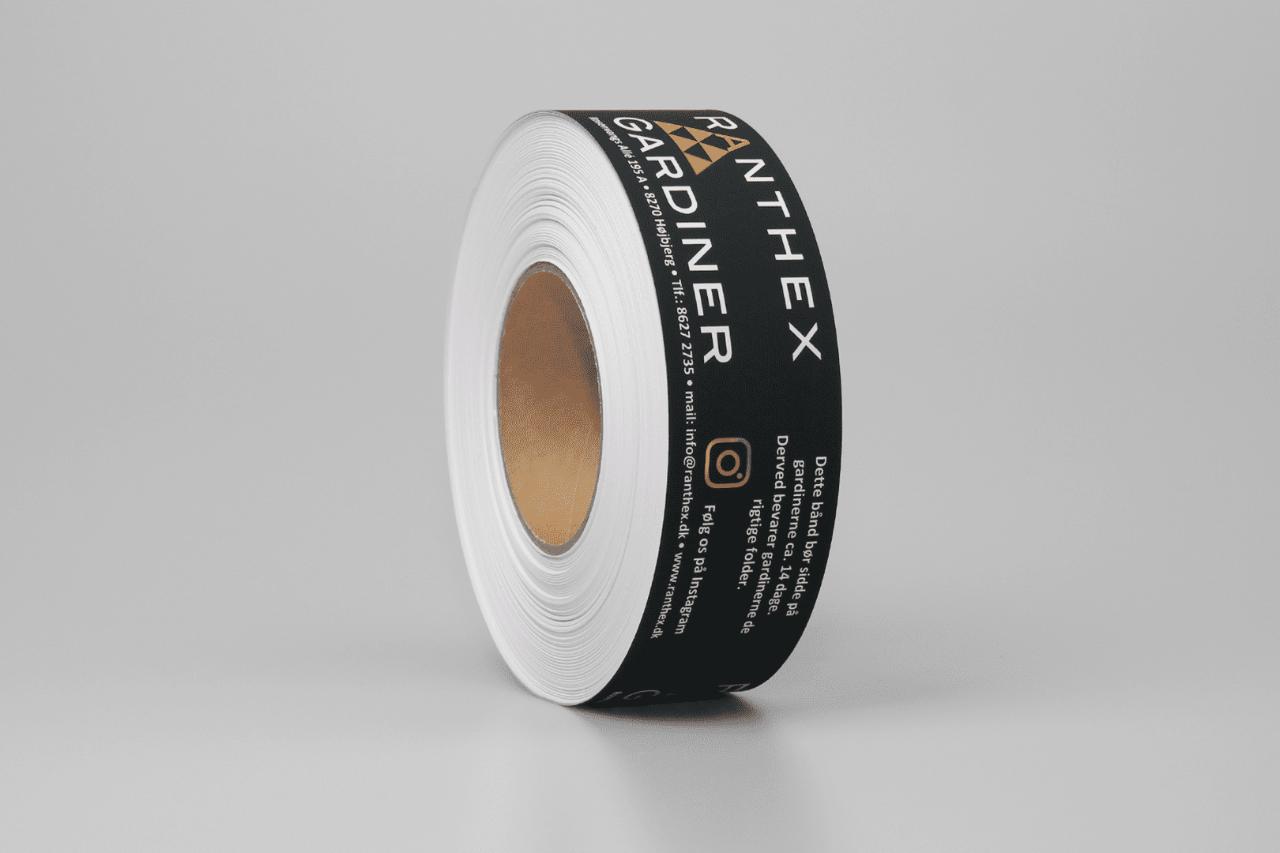 Papirbånd med eget logo negativt 50mm x 100mtr